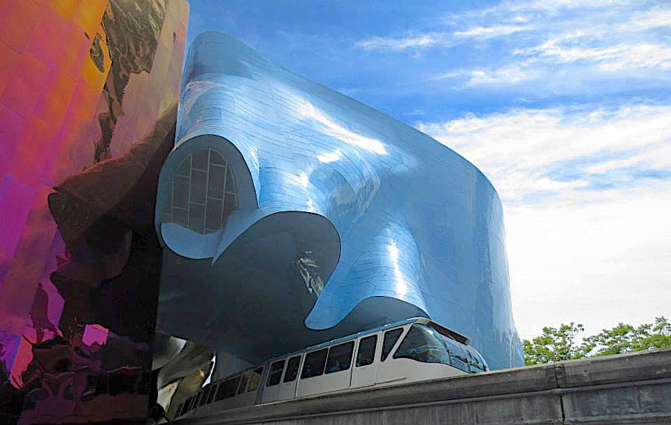 Red and blue wavy metal exterior of MOPOP and the Monorail.
